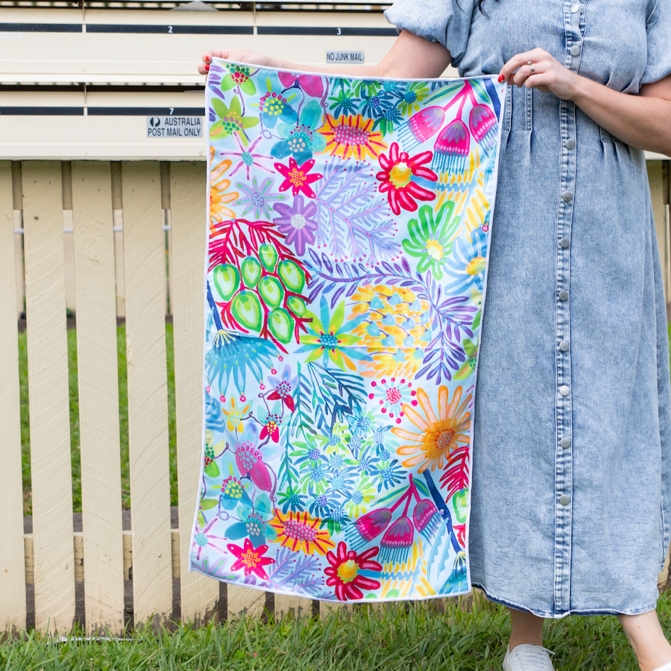 Colorful floral towel with a white background