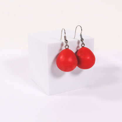 Red matte everyday drop earrings on a white background. 