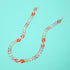 Flat lay of multi coloured chain link glasses chain. 