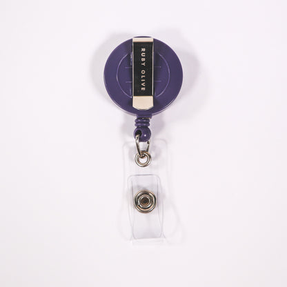Purple badge reel backing on a white background. 