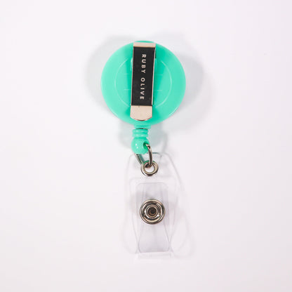 Aqua card badge reel on a white background.