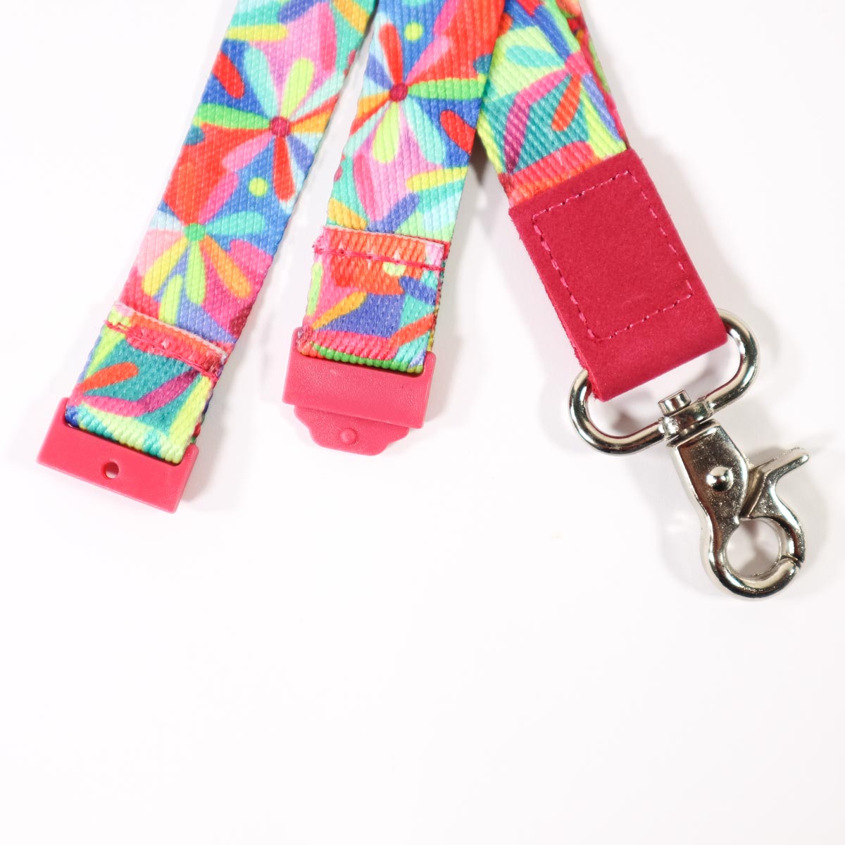 Multi coloured flower patterned lanyard with safety clasp.