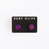 Purple flat round wood studs on white background.