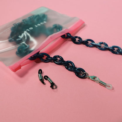 Blue marble mask chain in a Ruby Olive branded pouch. 